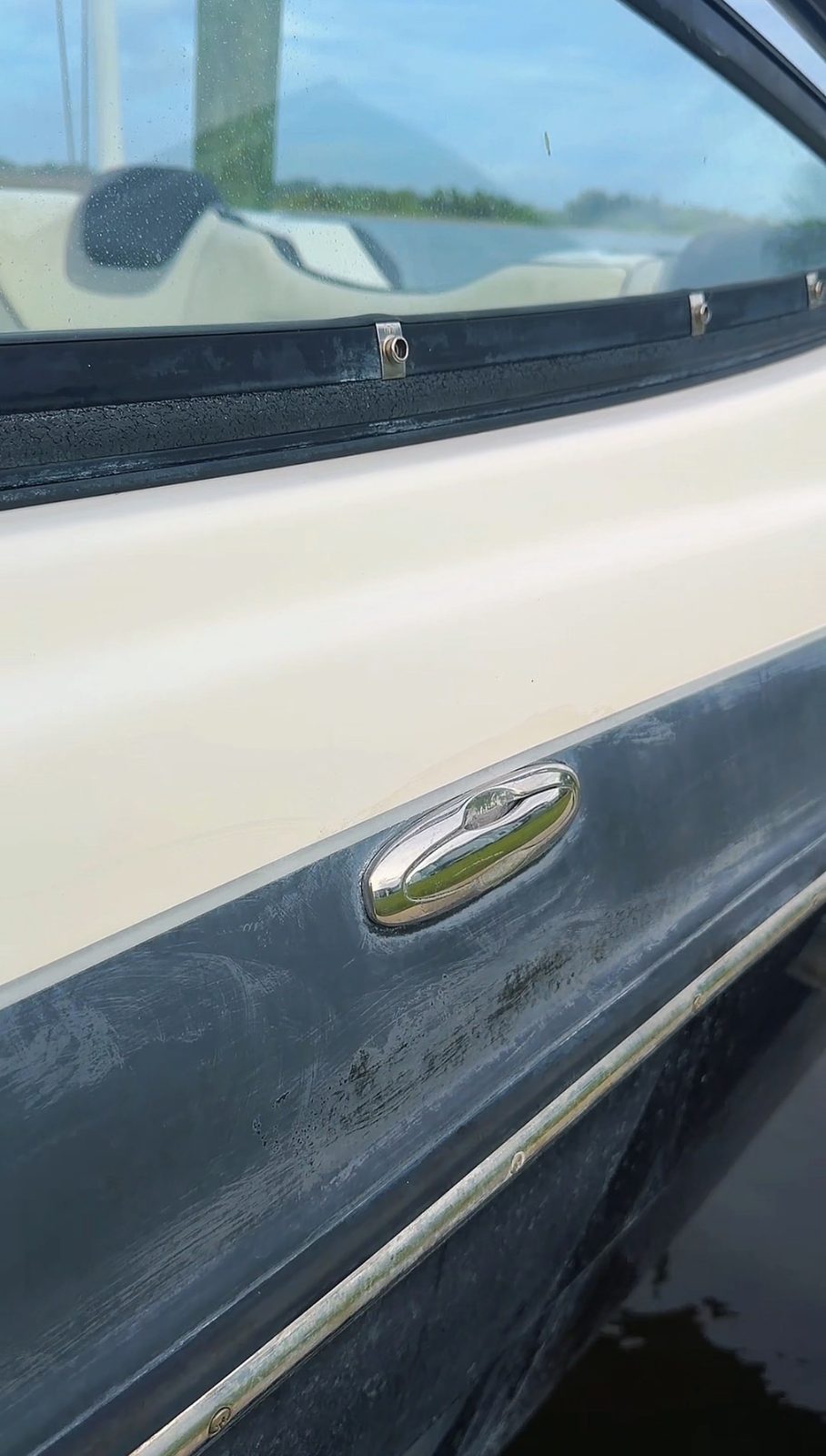 Faded, oxidized dark hull before correction